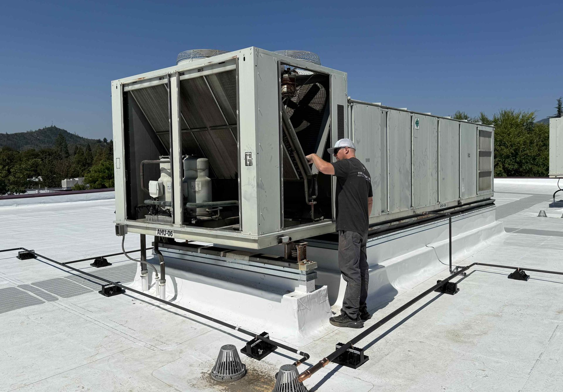 Military-trained HVAC expert Justin from Trademark Tech designing and installing complete commercial HVAC system in Southern Oregon business facility