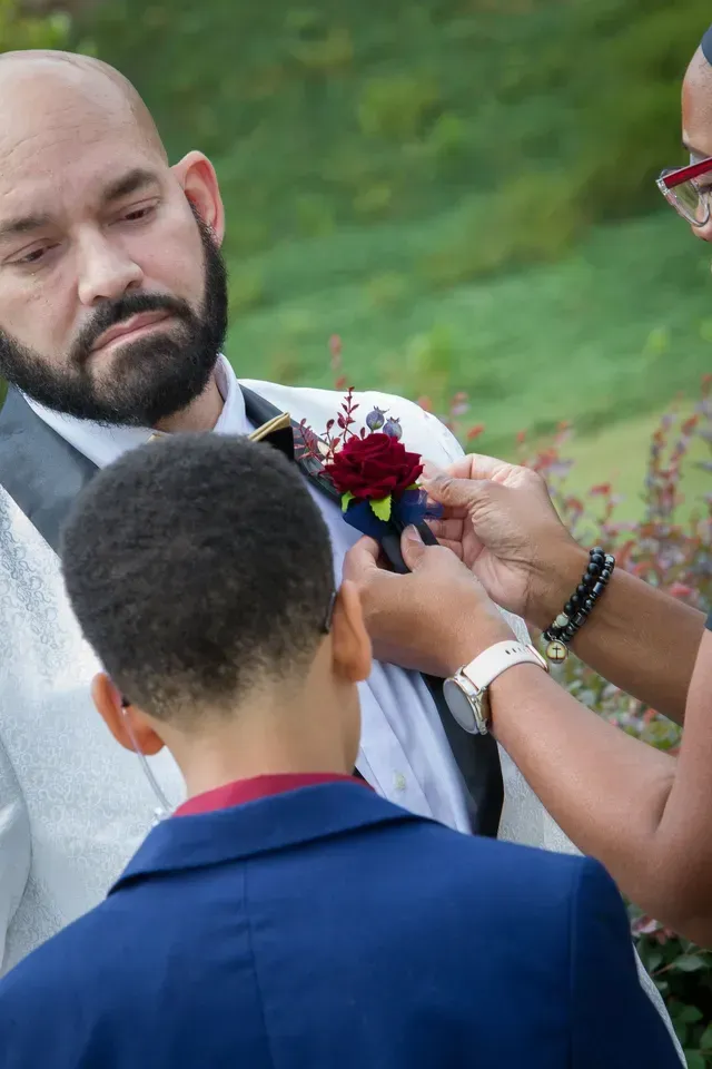 A Man Putting Flowers For the Husband Suite — Atlanta, GA — Pristine Chapel