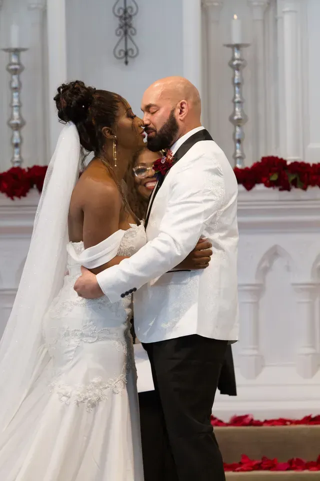 A Husband and Wife Kissing Each Other — Atlanta, GA — Pristine Chapel