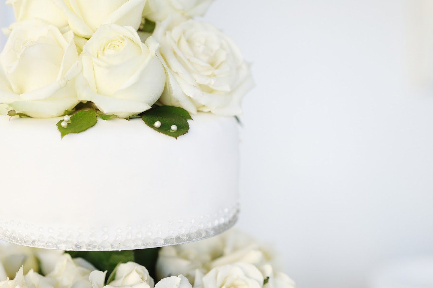 White Roses on Top of a Beautiful Cake — Metro Atlanta, GA — Pristine Chapel