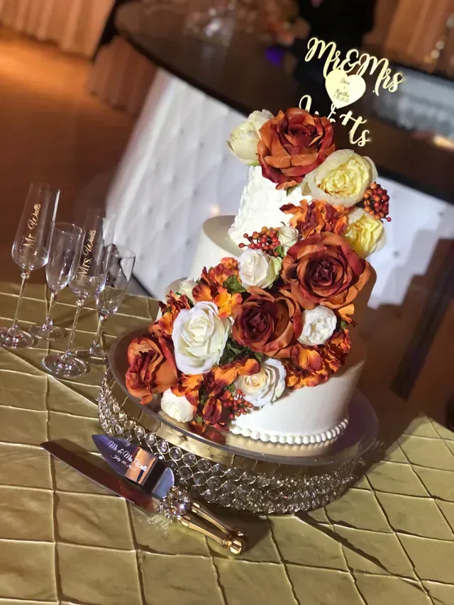 Cake with Orange Flower Design — Atlanta, GA — Pristine Chapel
