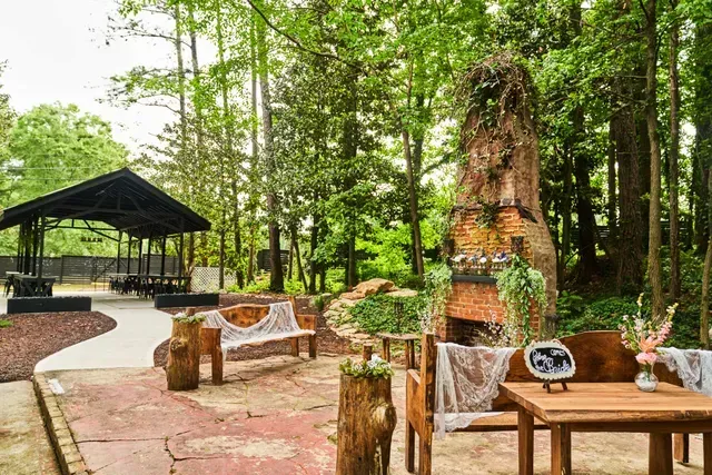 Fireplace with Wooden Tables and Chairs — Atlanta, GA — Pristine Chapel