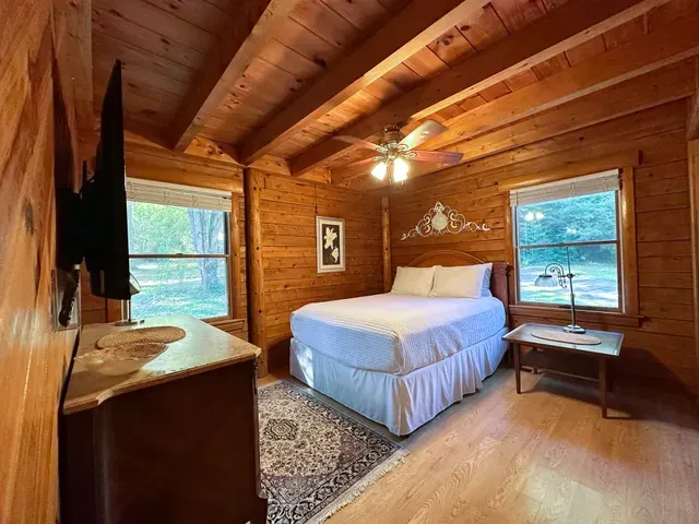 Cabin Bedroom With Open Window — Atlanta, GA — Pristine Chapel