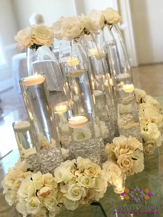 Flowers with Candles on Glasses — Atlanta, GA — Pristine Chapel
