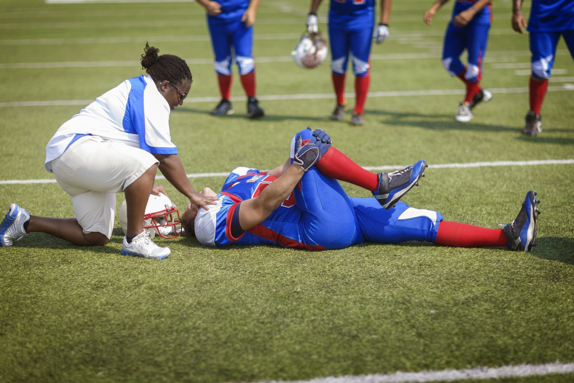 Football player having a knee injury | Colorado Springs, CO | The Partridge Family Practice