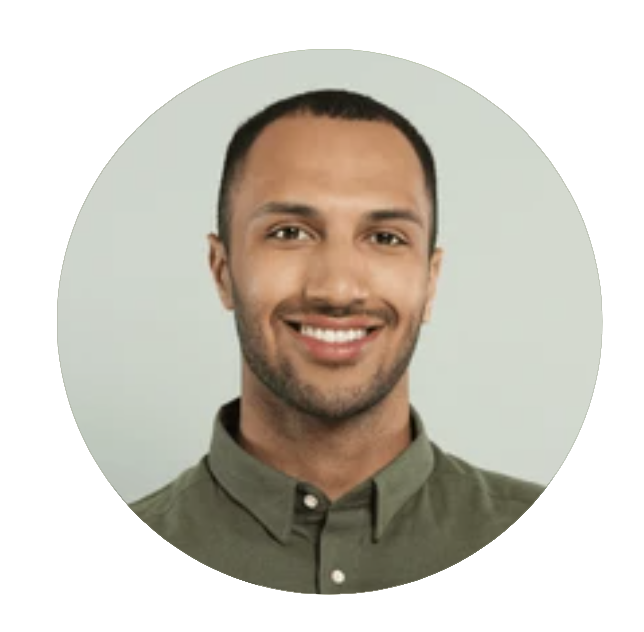 Smiling man in a green shirt.