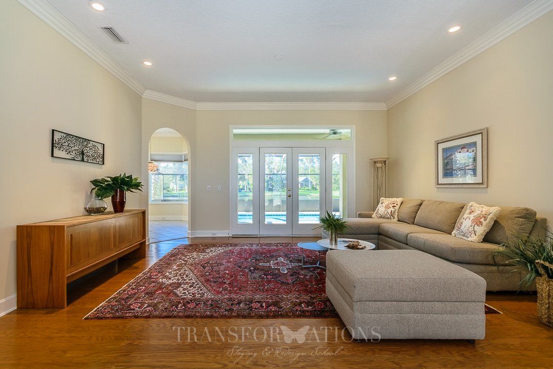 Staged open-concept sitting room by Transformations Staging & Redesign School