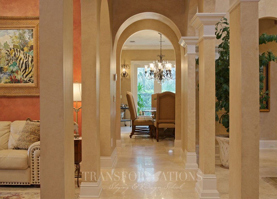 A hallway leading to a living room and dining room