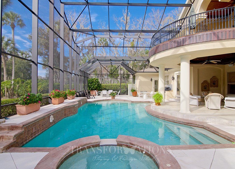 There is a large swimming pool in the middle of the house.