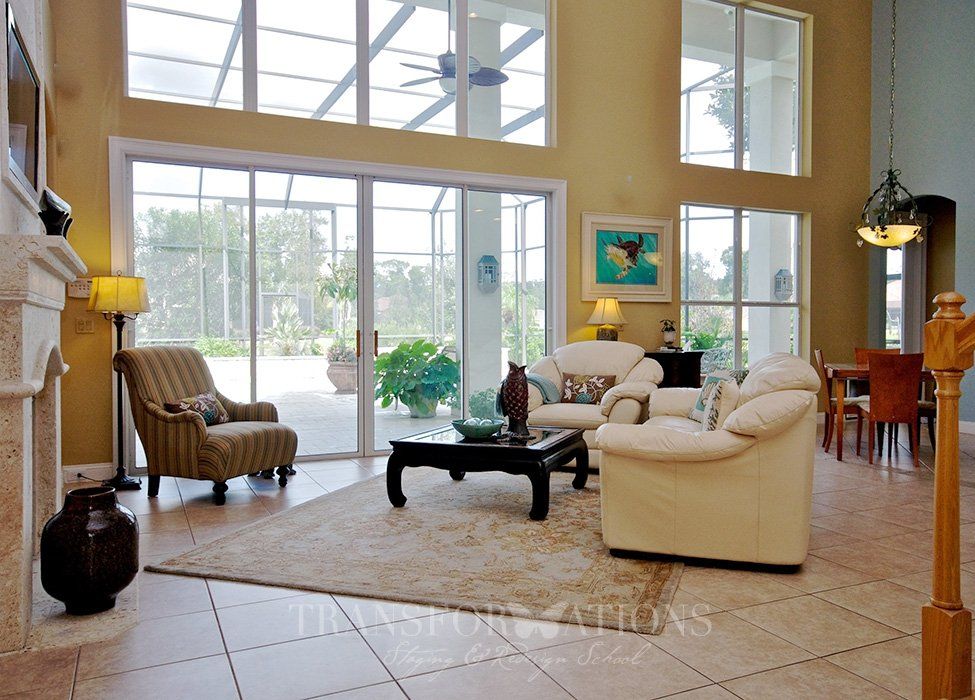A living room with a fireplace and sliding glass doors