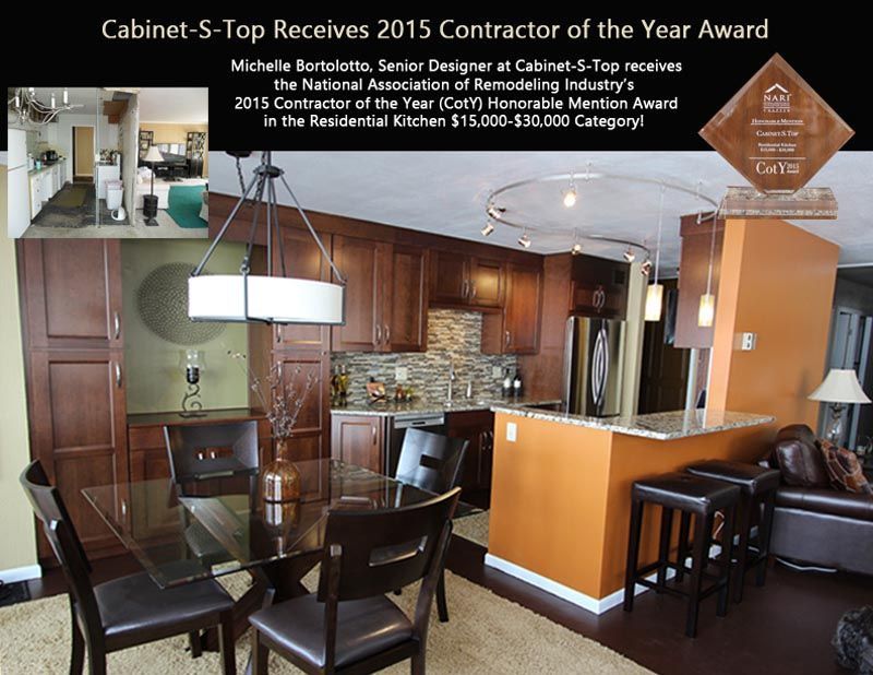 A picture of a kitchen with the words cabinet s top receives 2015 contractor of the year award