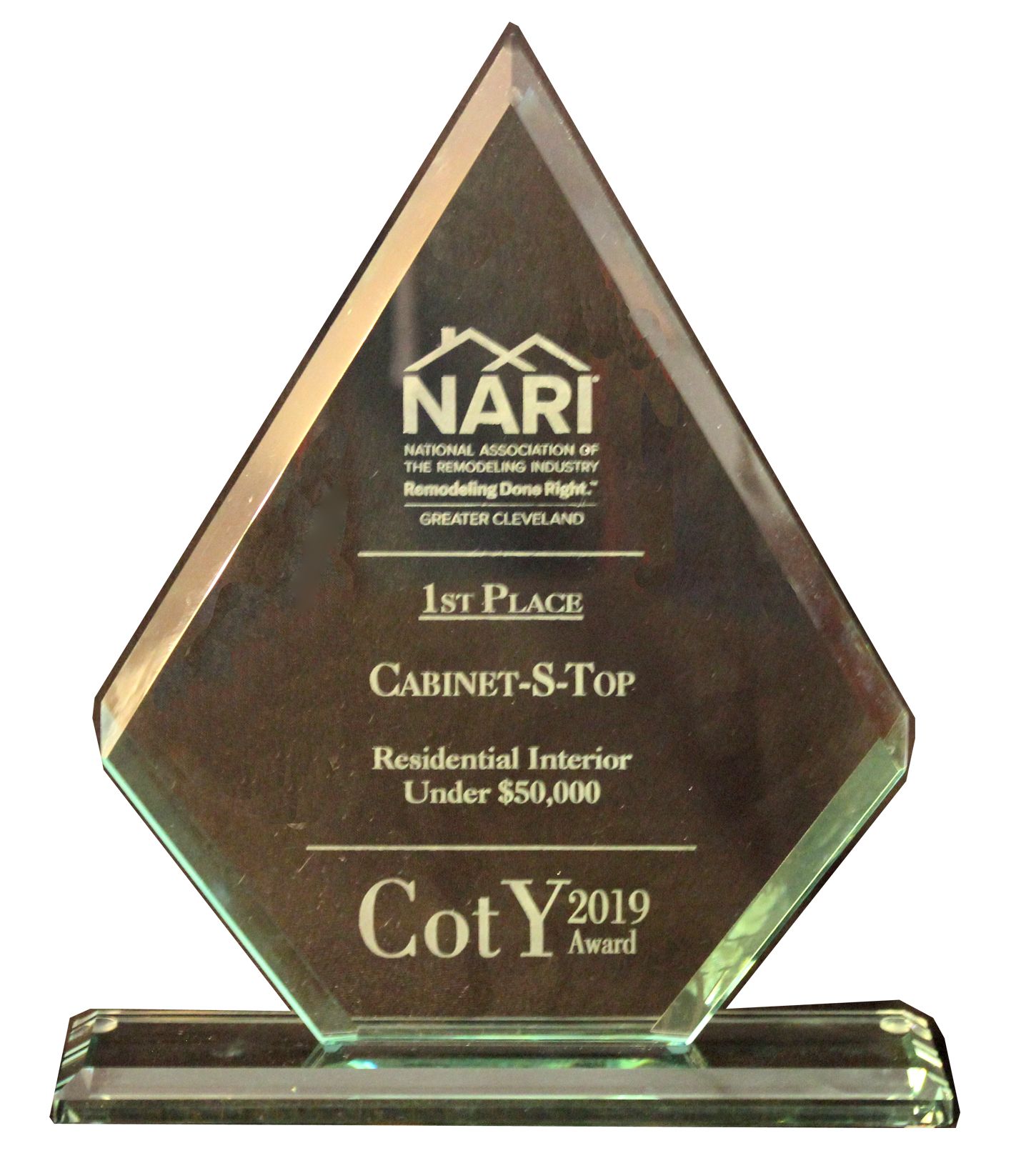 A glass plaque that says 1st place cabinet-s-top residential interior under $ 50,000