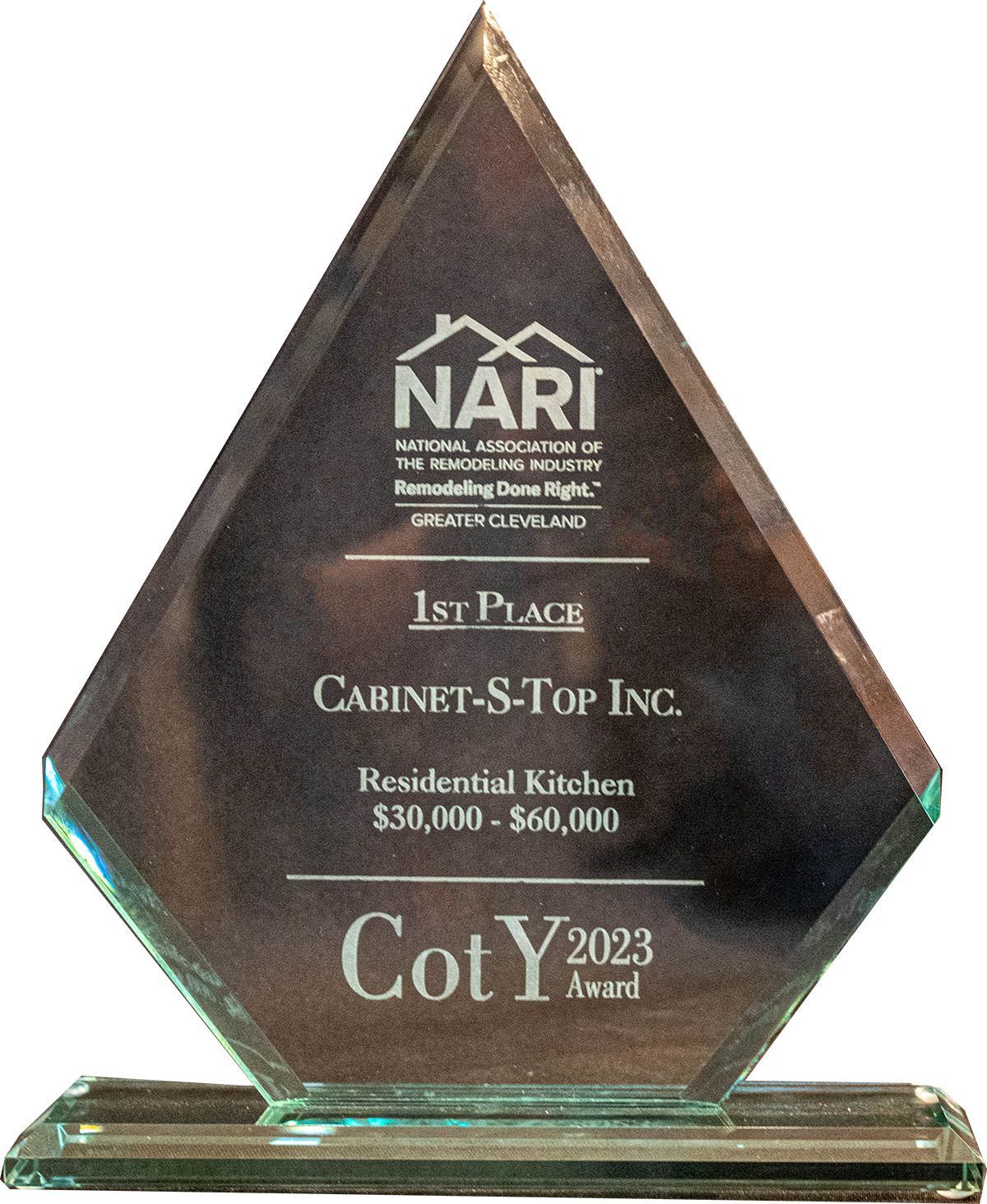 A trophy that says cabinet-s-top inc. on it