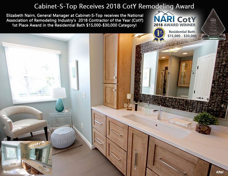 A bathroom with a double sink and a chair.