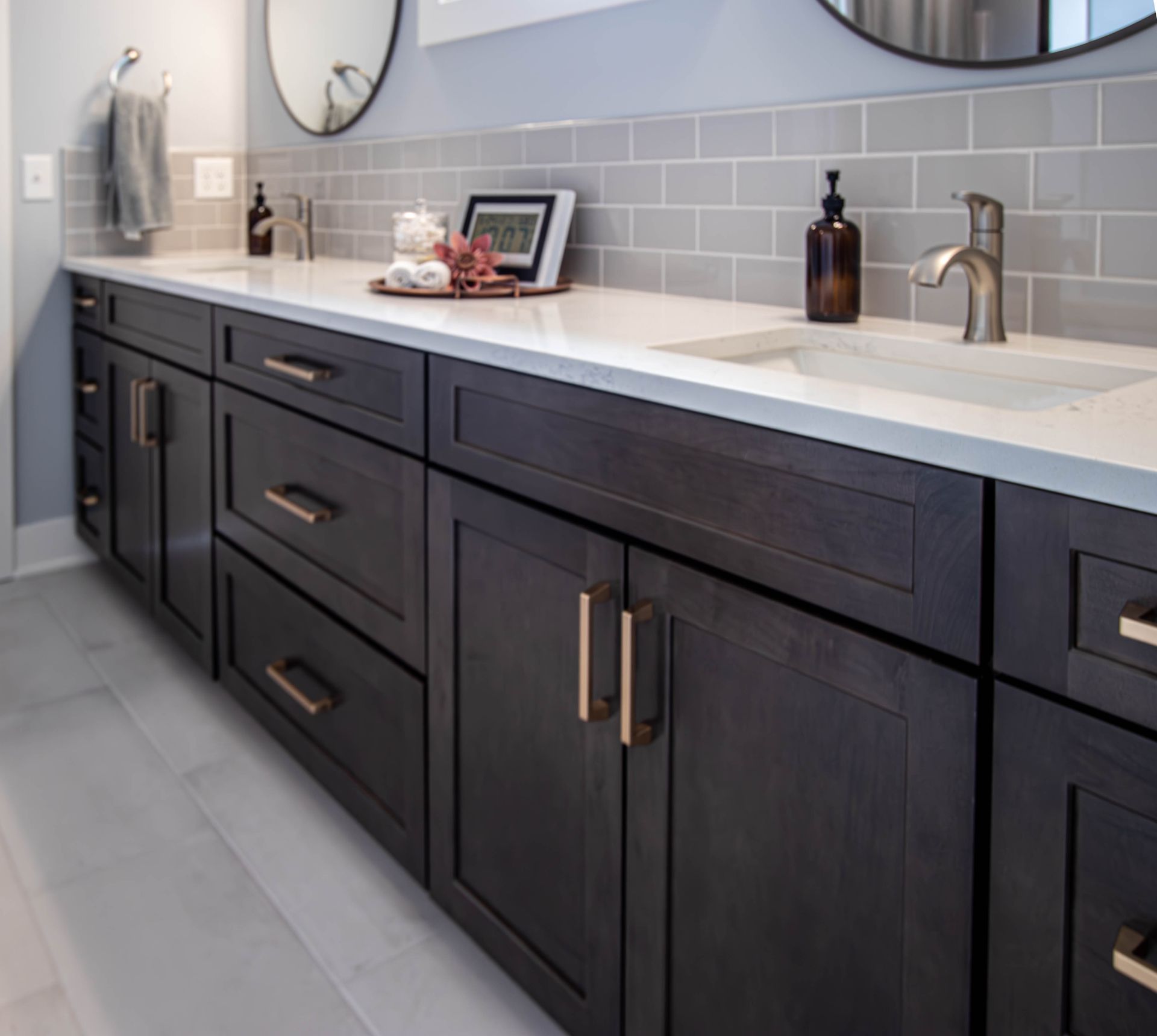 A bathroom with two sinks and a mirror