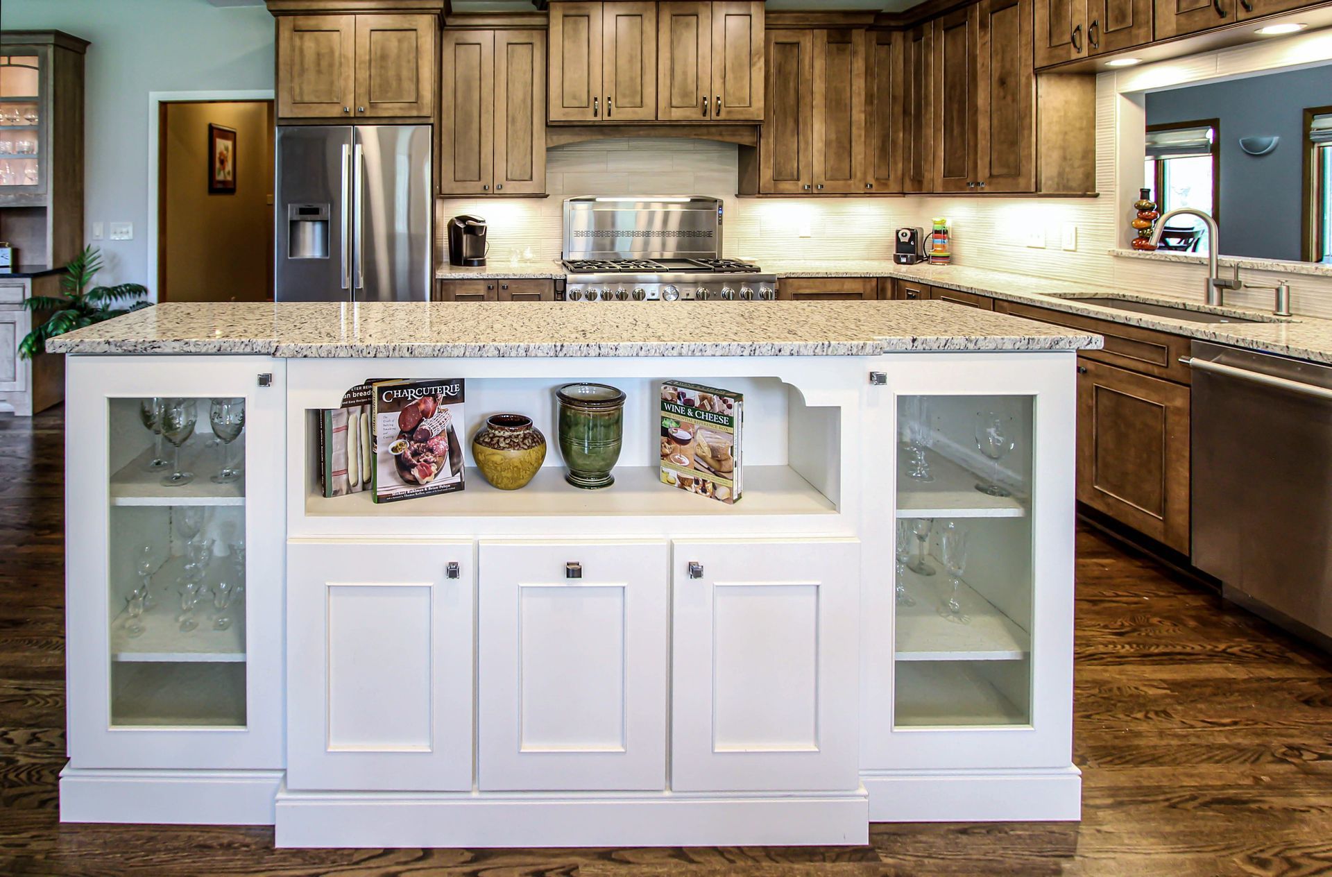 A kitchen with a large island in the middle of it.
