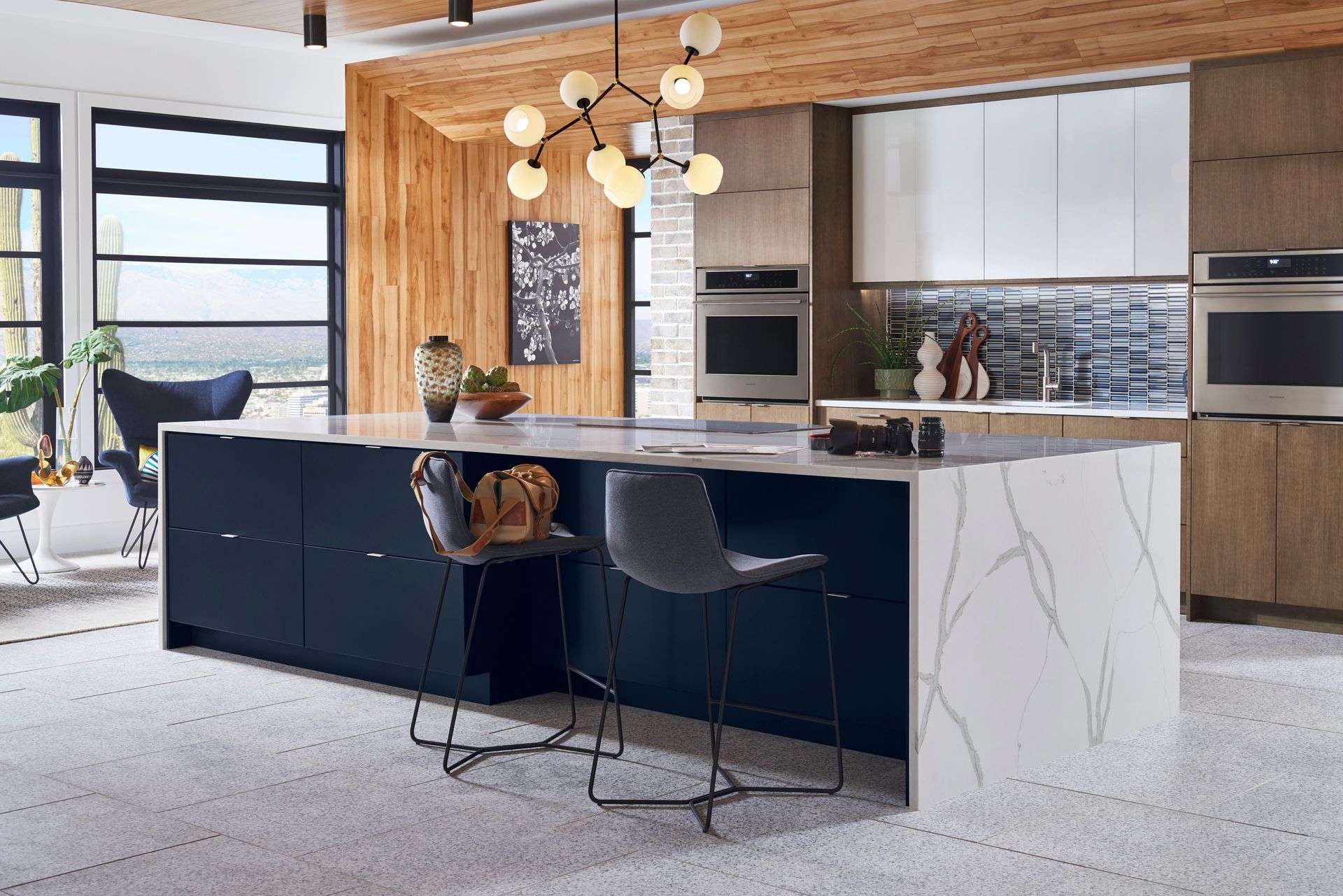 A kitchen with a large island in the middle of the room.