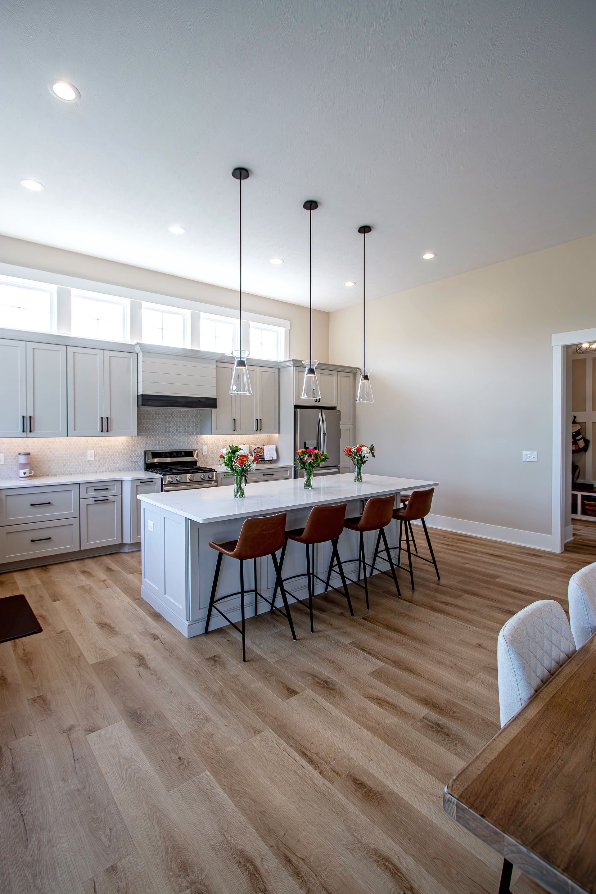 A kitchen with a large island in the middle of the room.