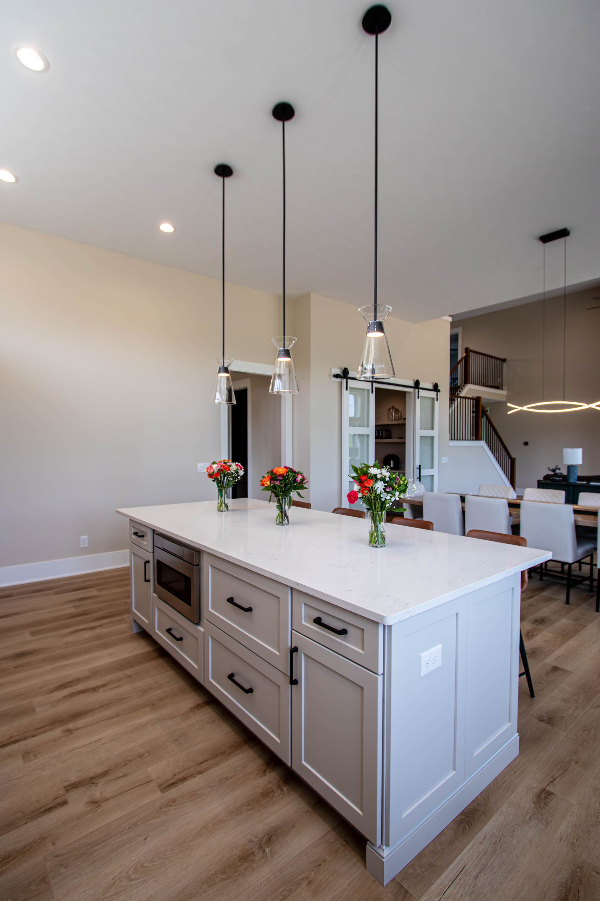 There is a large island in the middle of the kitchen.