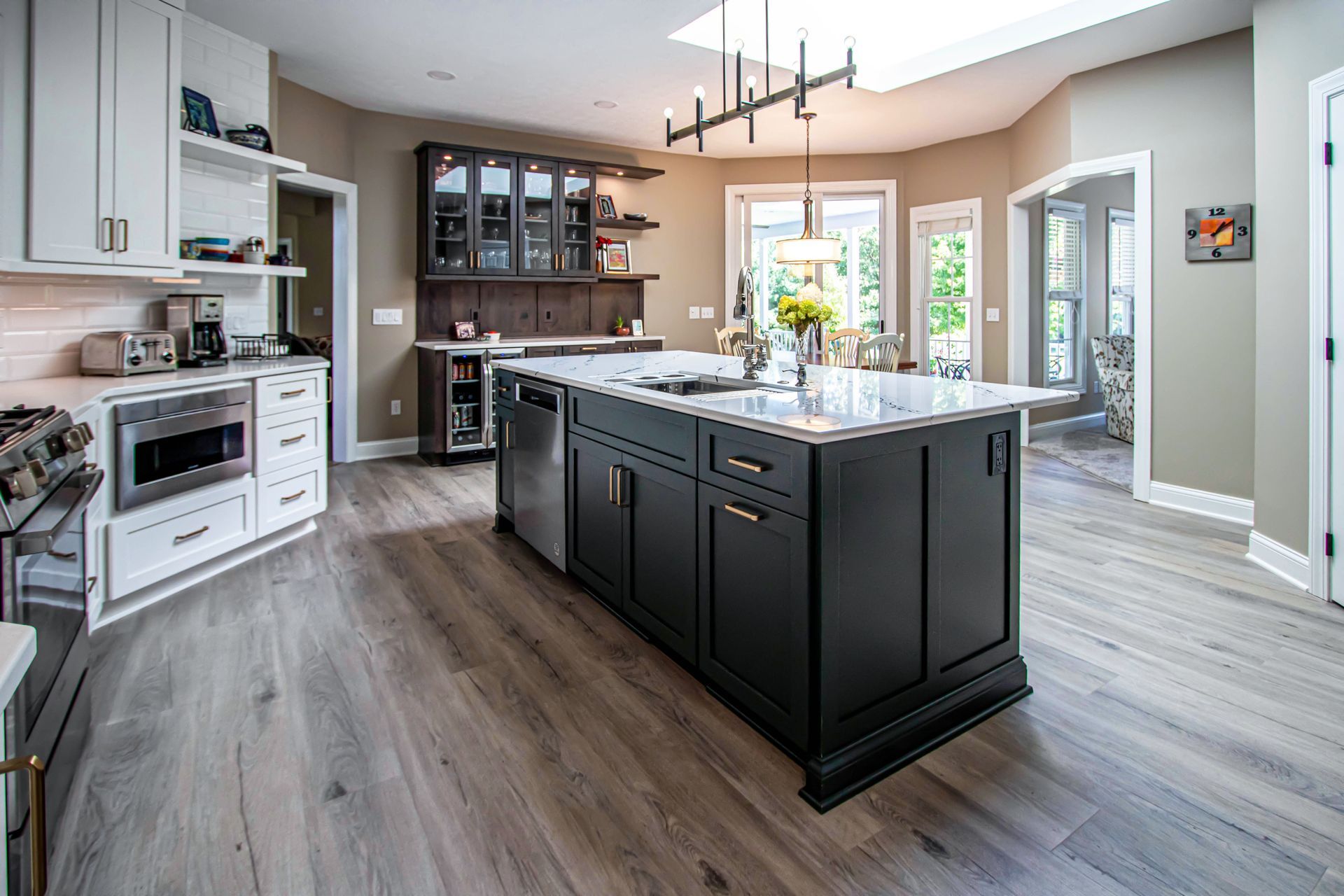 There is a large island in the middle of the kitchen.