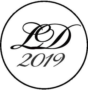 A black and white logo for ld 2019 in a circle on a white background.