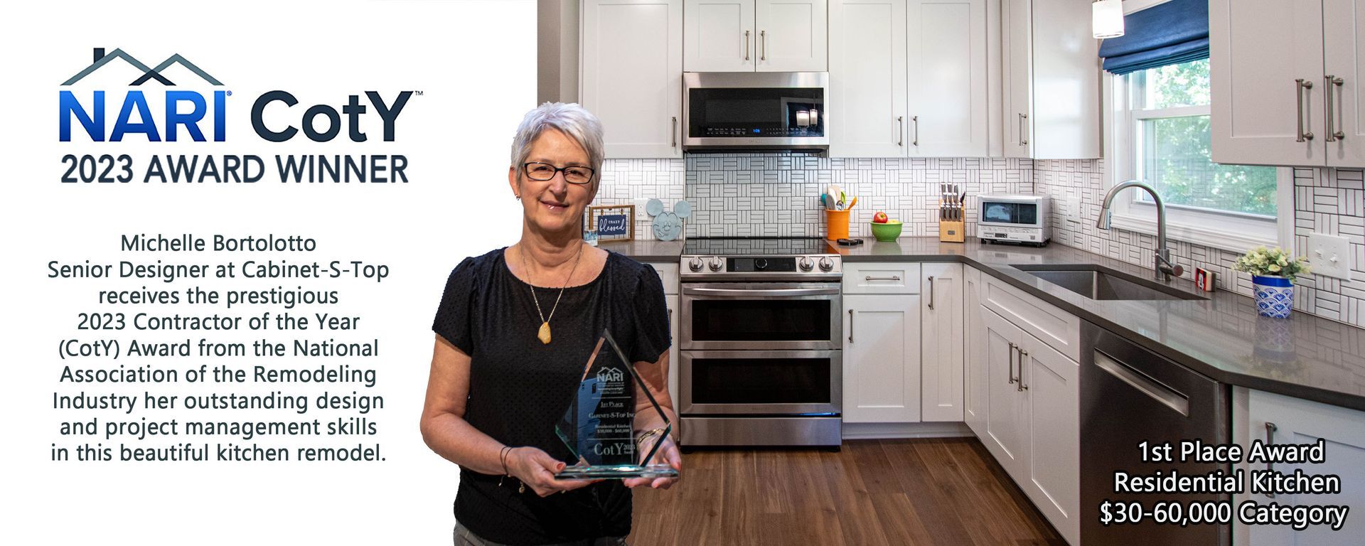 A woman is holding an award in front of a kitchen.