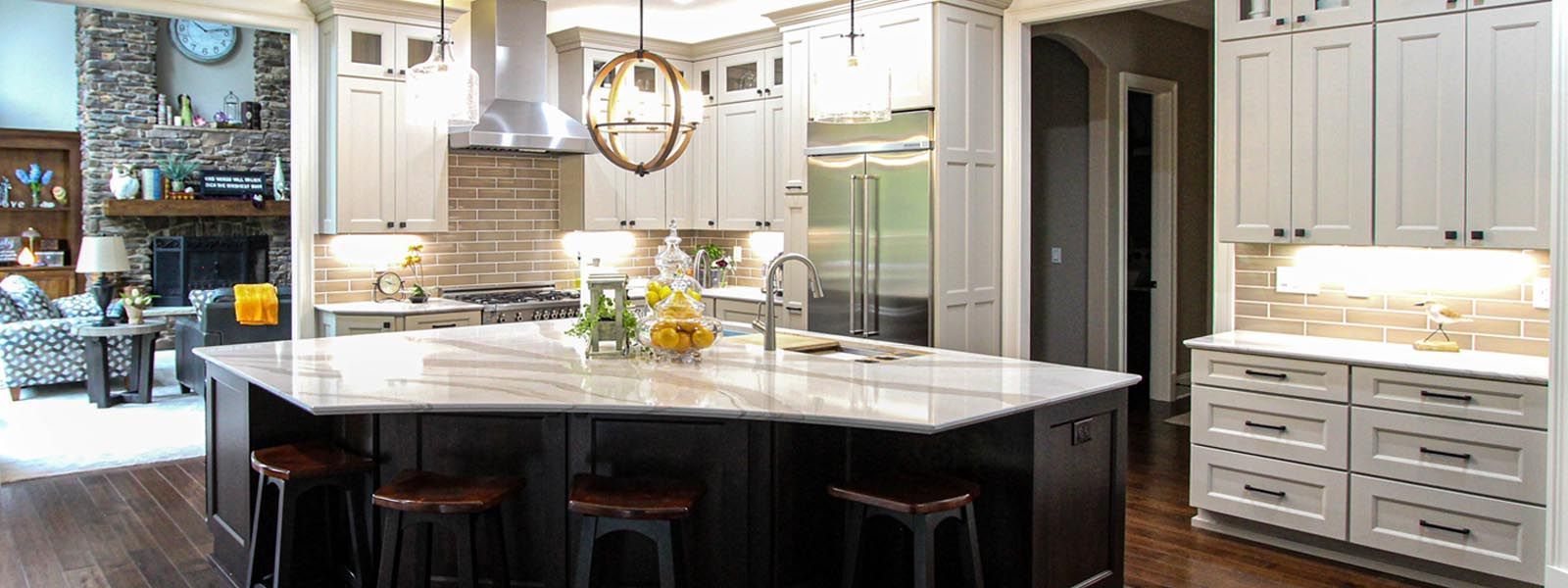 A kitchen with a large island in the middle of it.