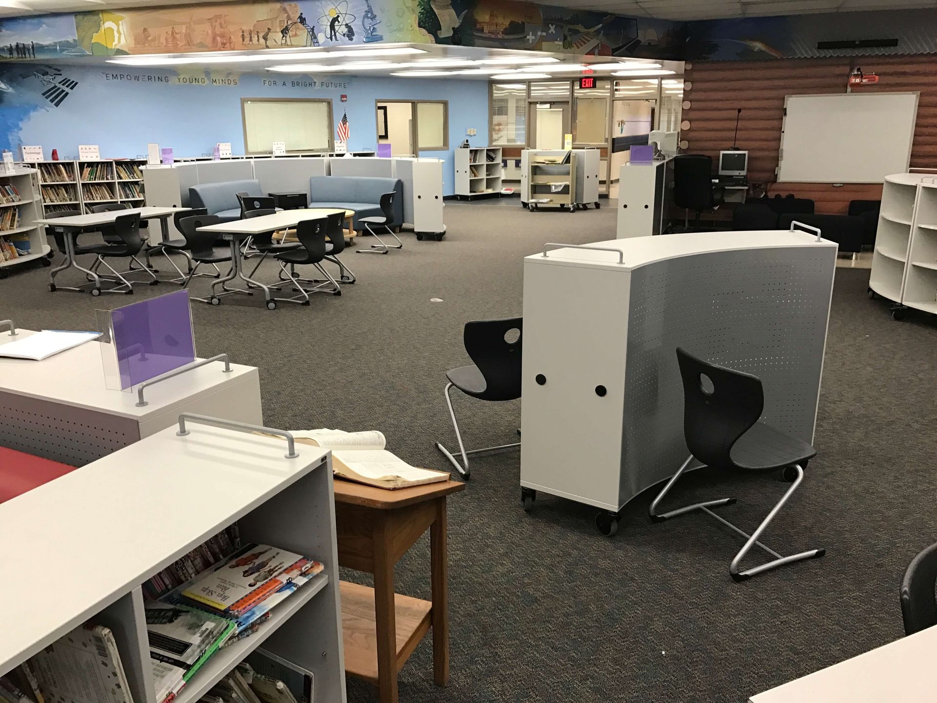 A large room with tables and chairs in it
