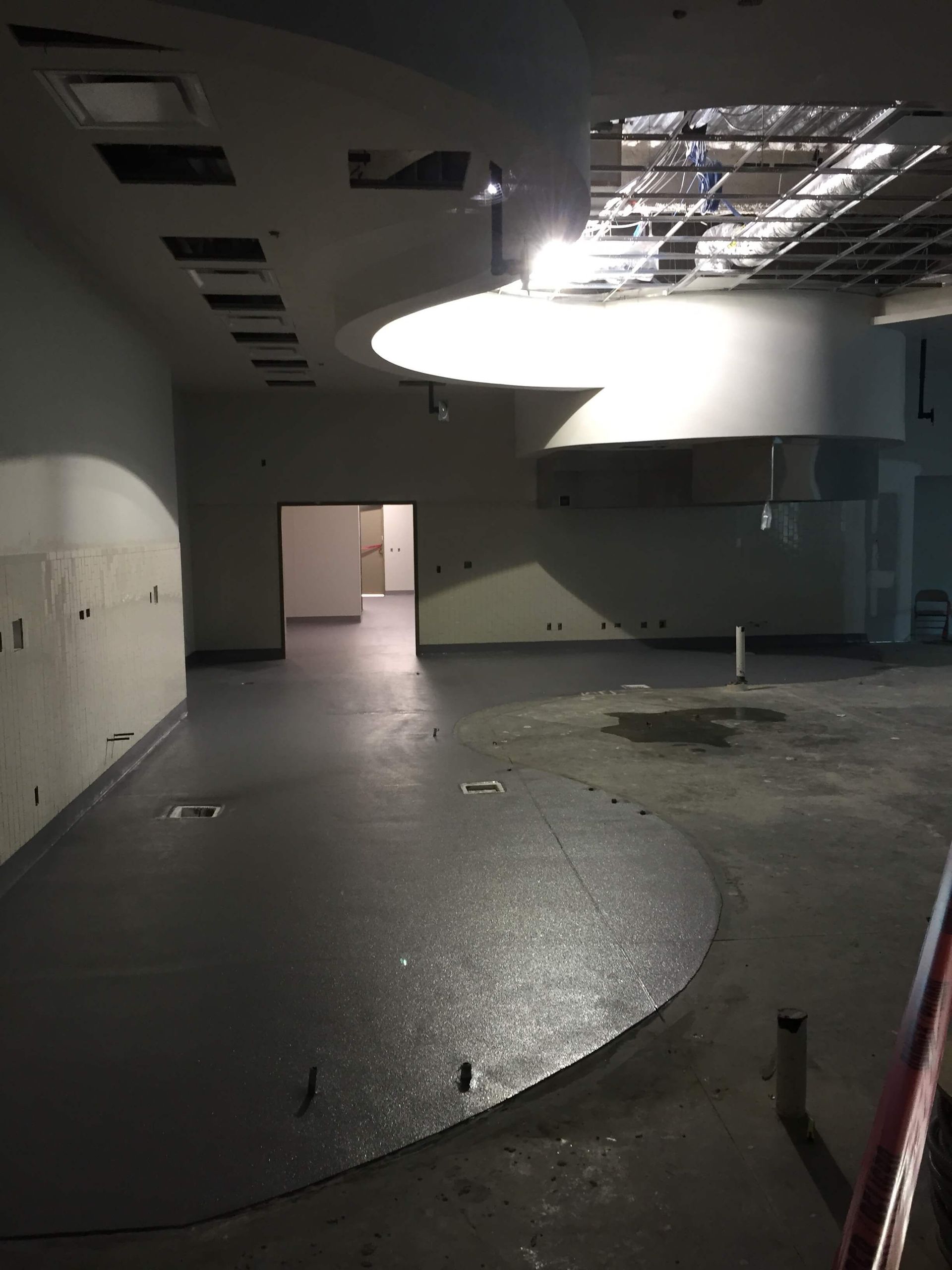 A large empty room with a circular floor