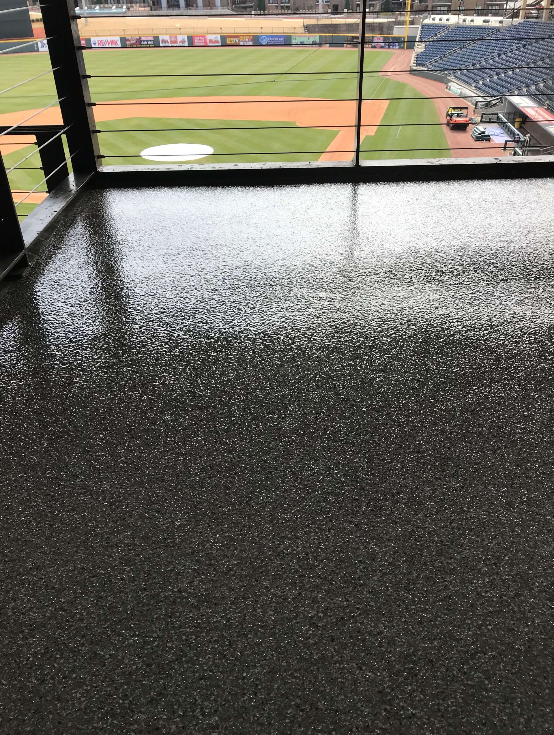 A view of a baseball field from a balcony.