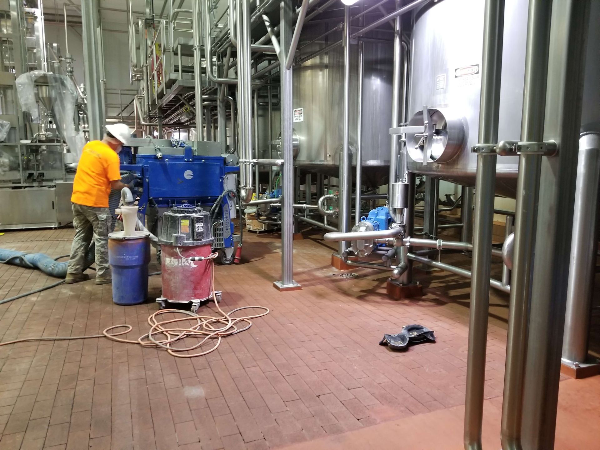 A man is working on a machine in a factory.