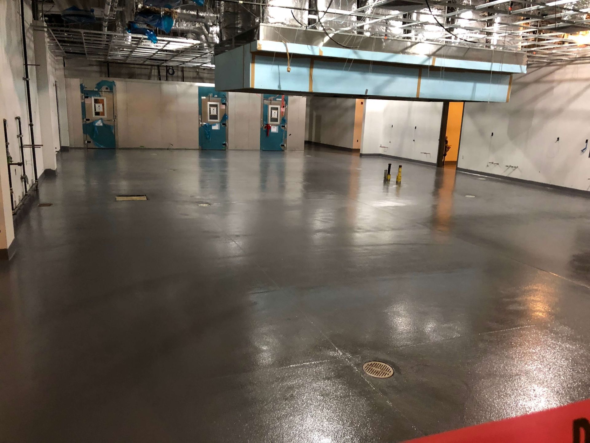 An empty room with a red sign that says do not enter