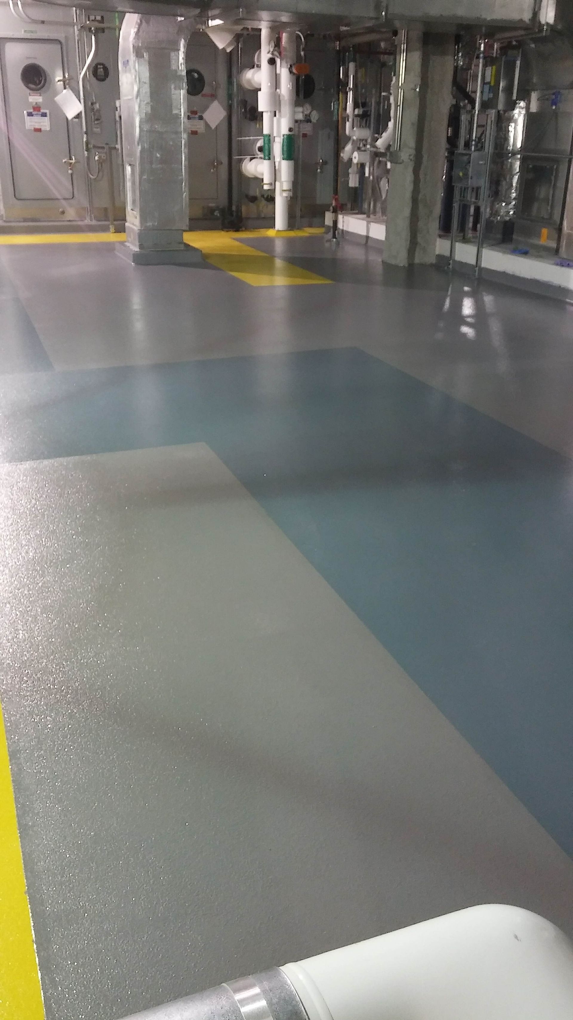 A very large room with a lot of pipes on the floor.