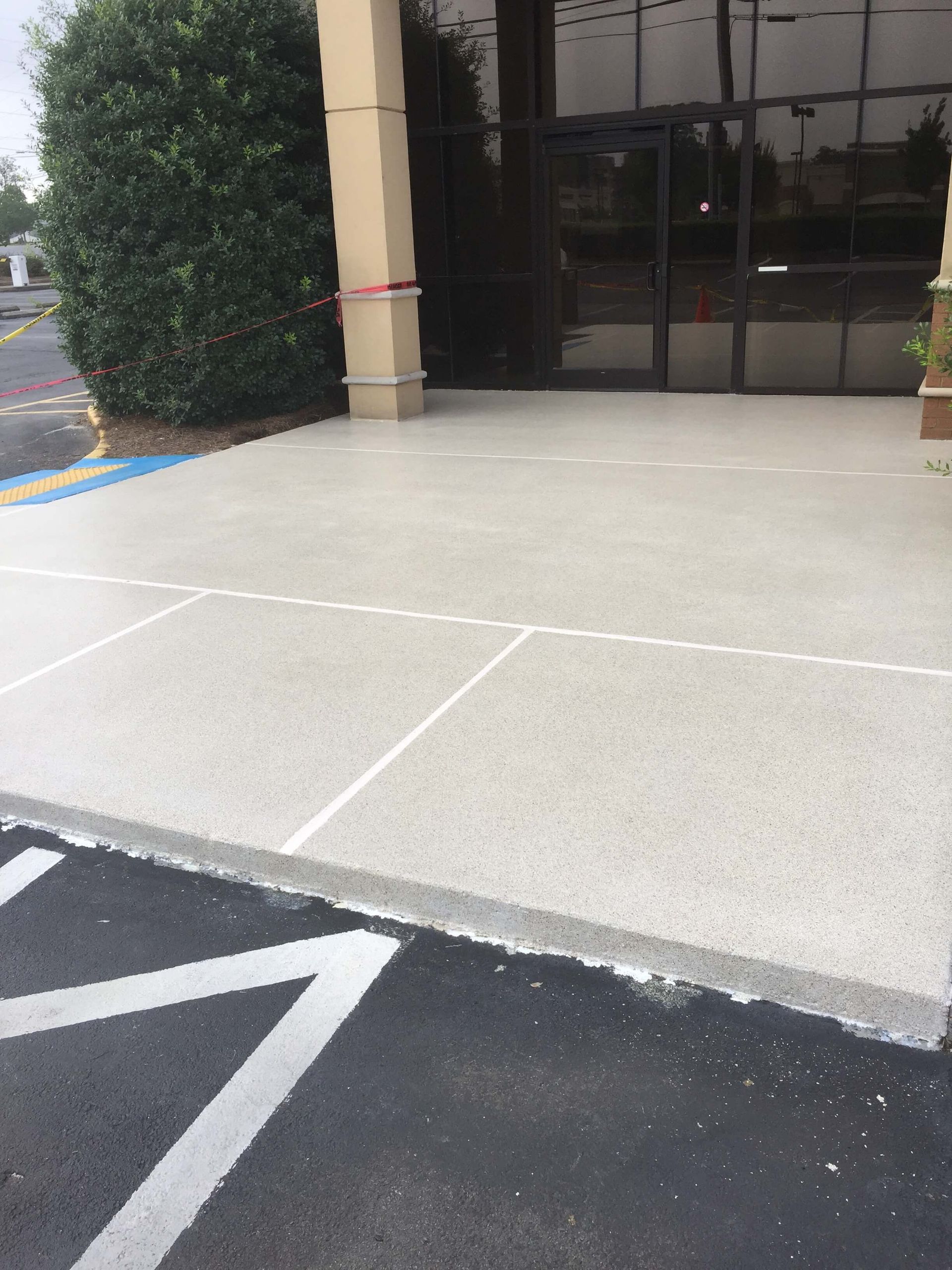 Exterior view of a building entrance with a concrete ramp