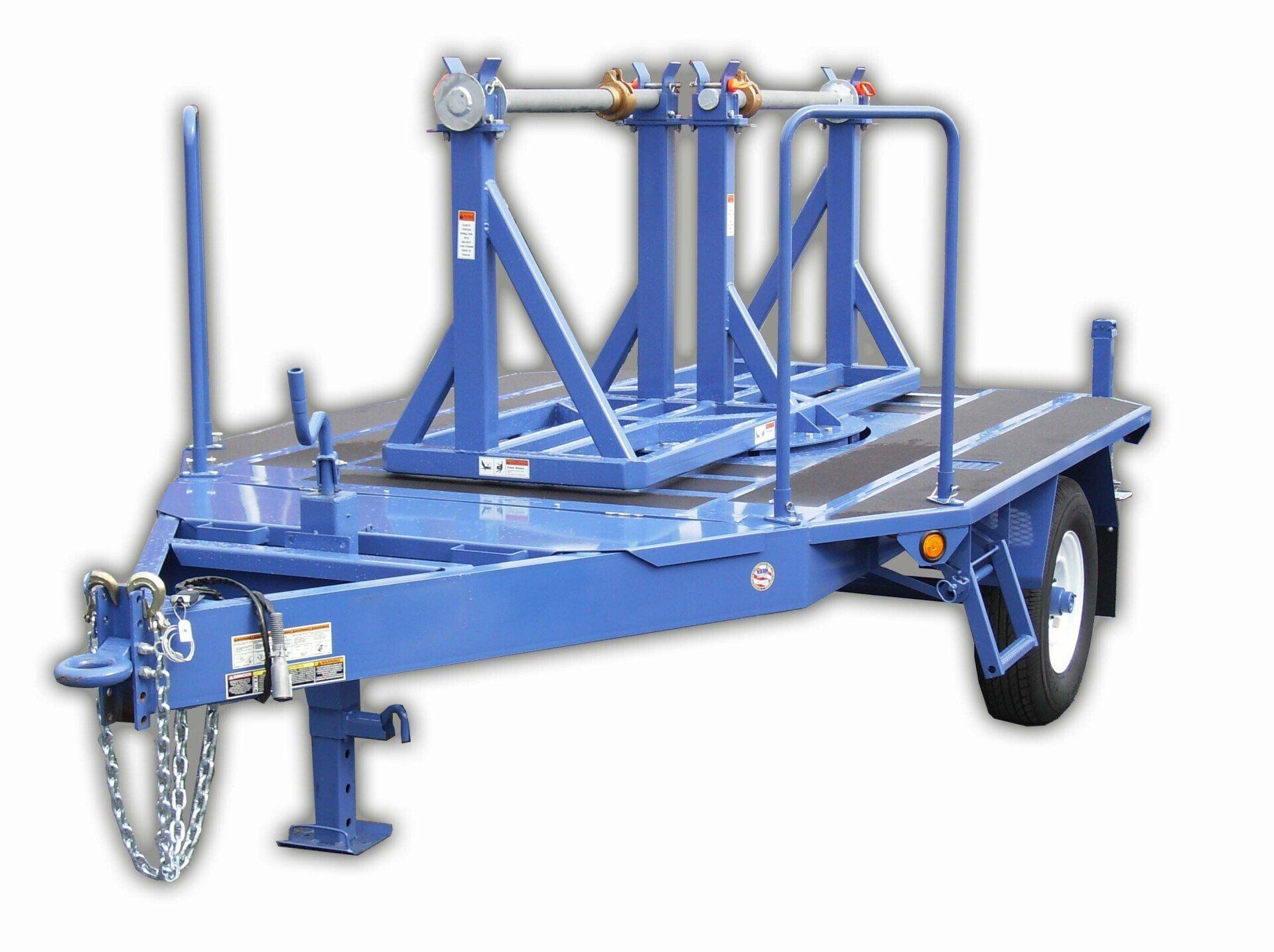 A blue trailer with a few pieces of metal on it