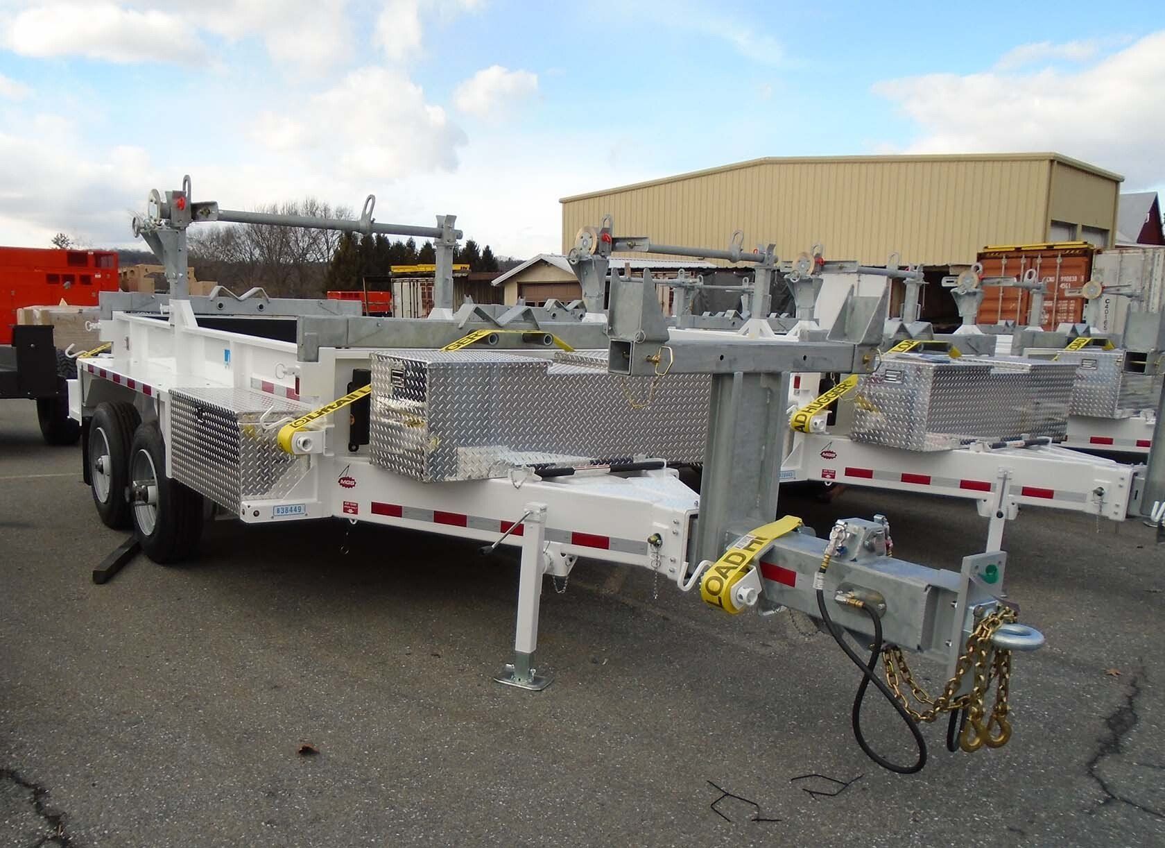 A trailer is parked in front of a building