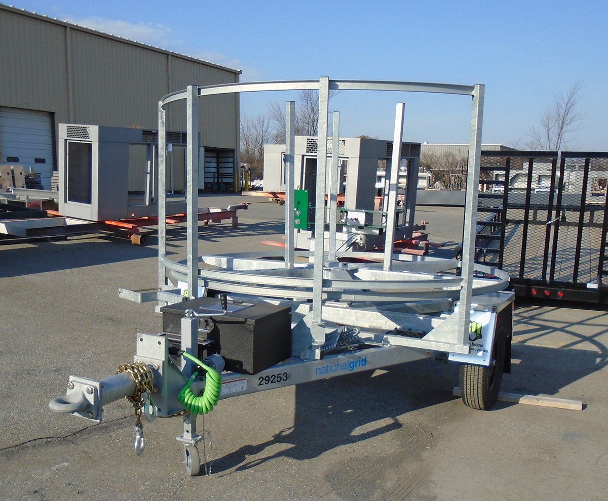 A trailer with a green rope attached to it