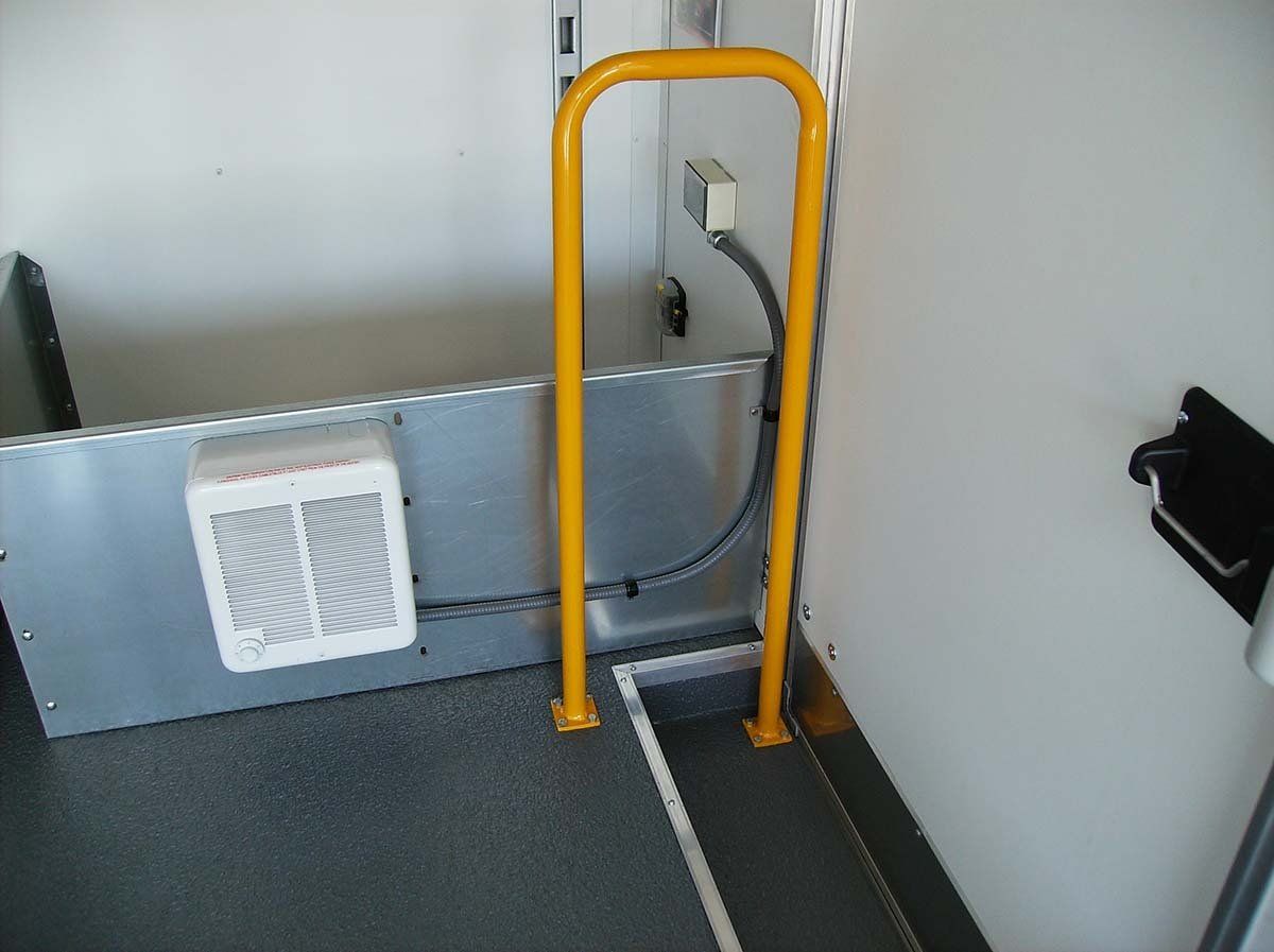 A bathroom with a yellow railing and a fan