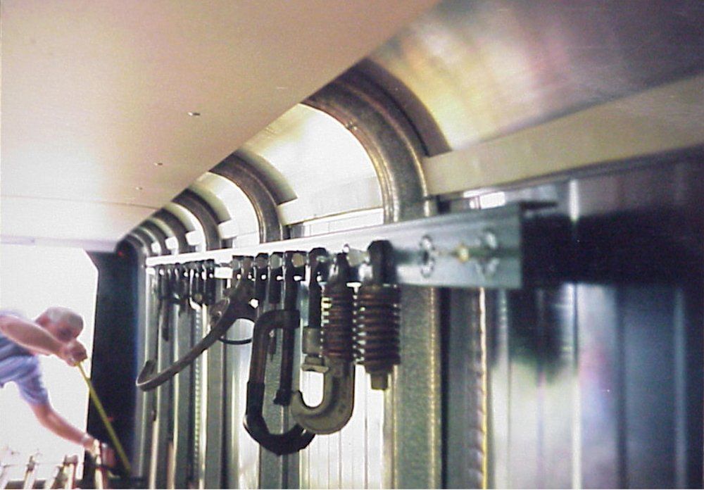 A man is measuring something with a tape measure