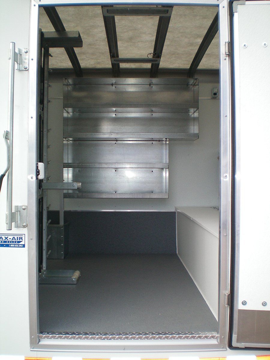 The inside of a truck with the door open