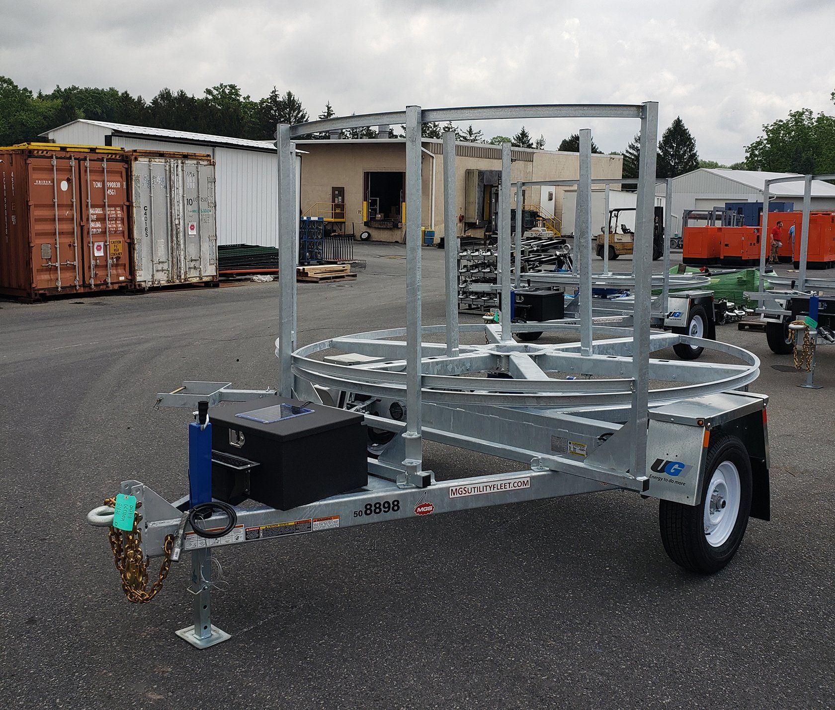 A trailer with a container in the background that says ' cargo ' on it