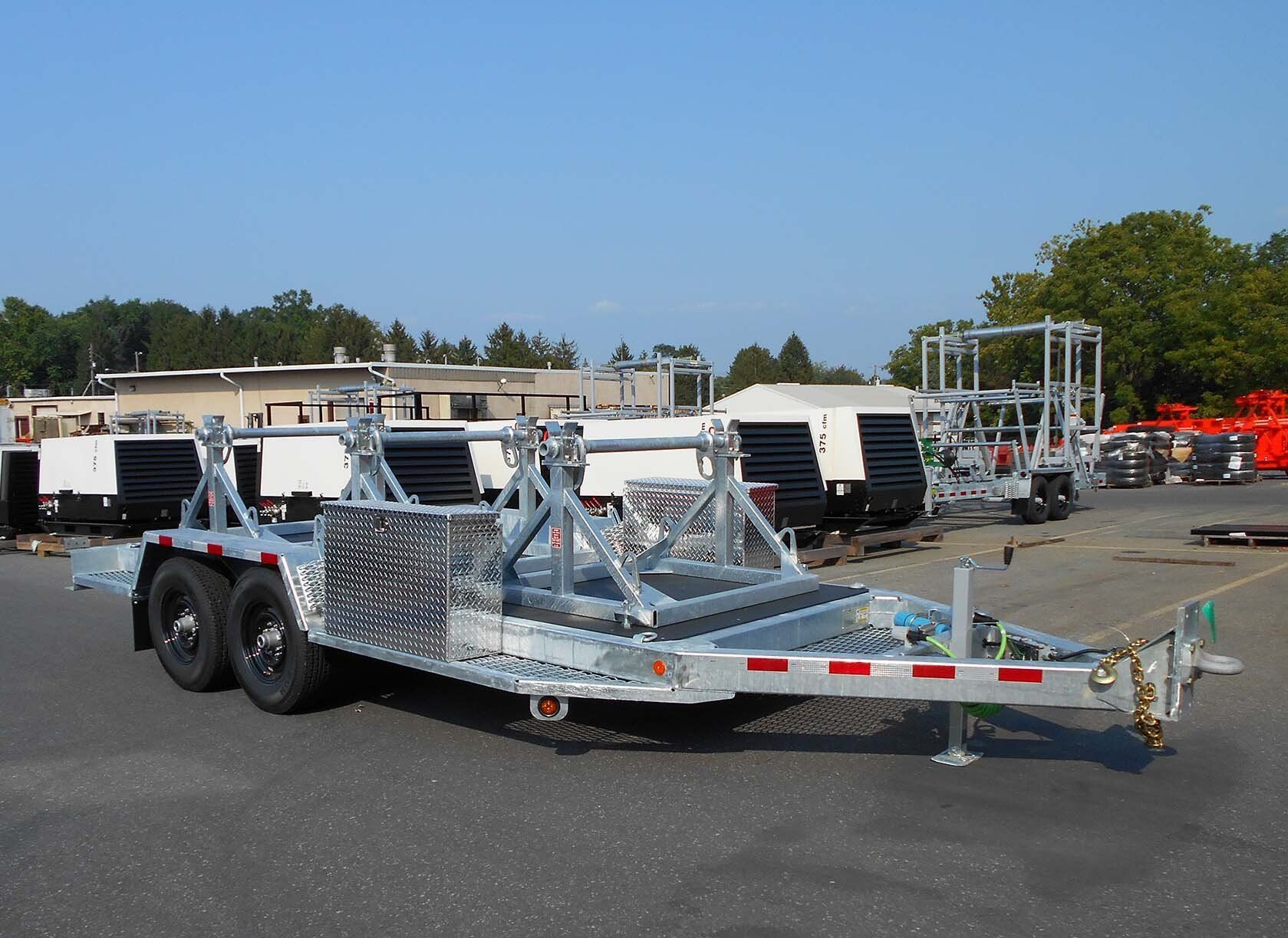 A trailer is parked in a parking lot in front of a building
