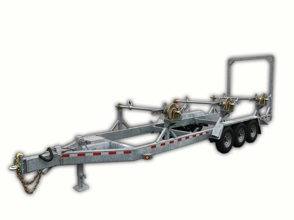 A silver trailer with three wheels on a white background.