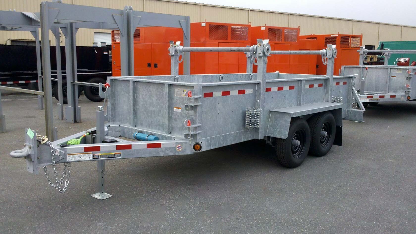A trailer is parked in front of a building