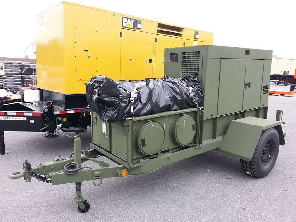 A green trailer with a yellow box that says cat on it