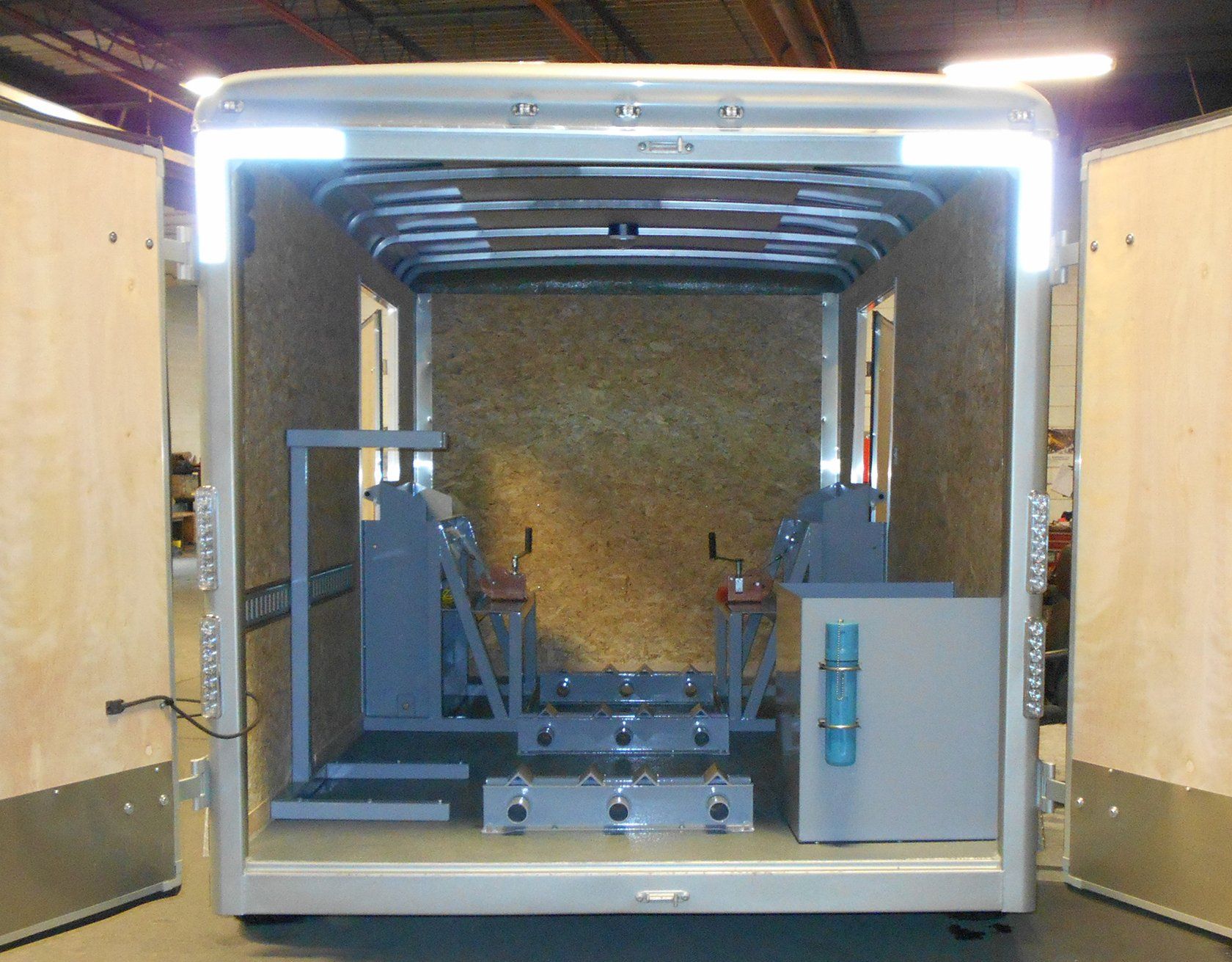 The inside of a trailer with a machine inside of it