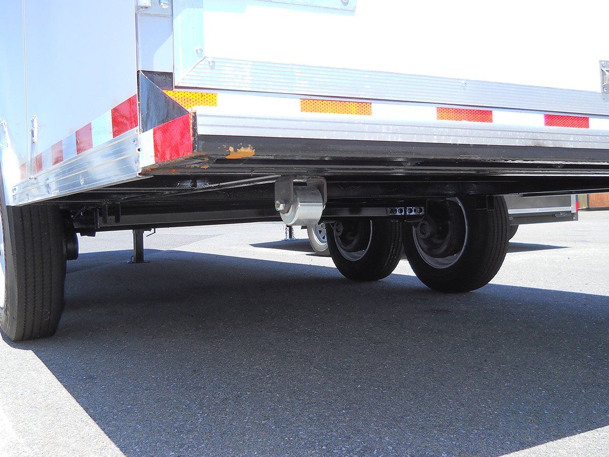 A trailer is parked on the side of the road.