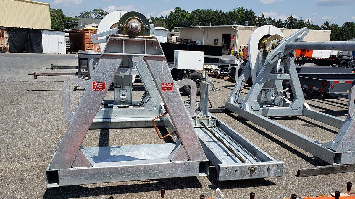 A bunch of metal pieces are sitting on the ground
