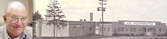 A man is sitting in front of a black and white photo of a building.