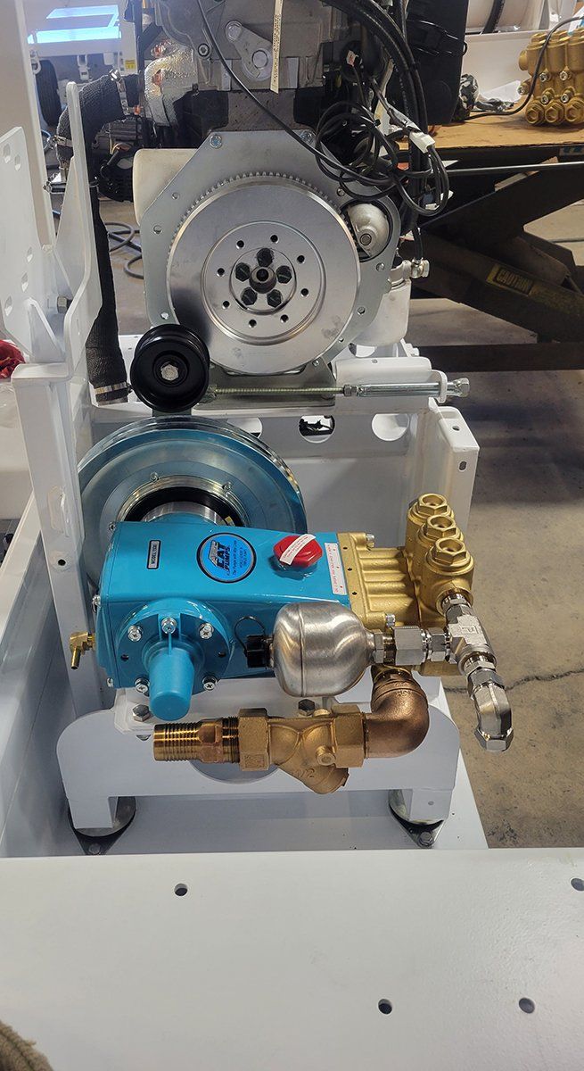 A blue and white machine is sitting on top of a white table.